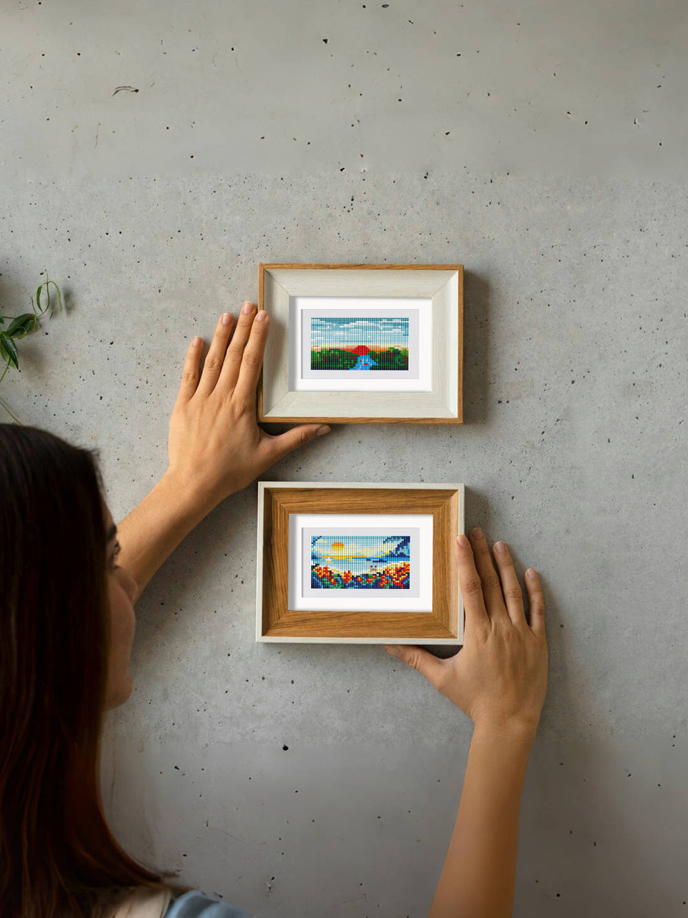 Two framed mini landscape diamond paintings held in hands, perfect for display or gifting.
