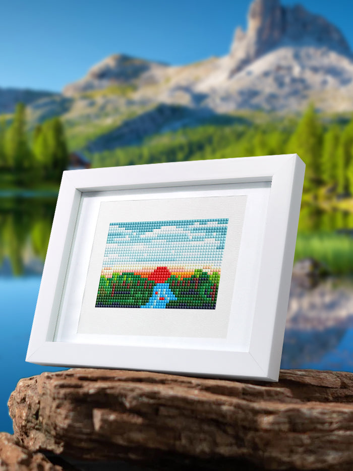 Framed landscape diamond painting of a lake and mountains, perfect for home decor or nature-inspired gifts.
