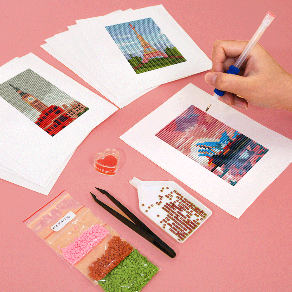 Three city-themed diamond painting canvases featuring Tokyo Tower, Eiffel Tower, and Sydney Opera House, partially completed; perfect for travel lovers and mindful DIY.