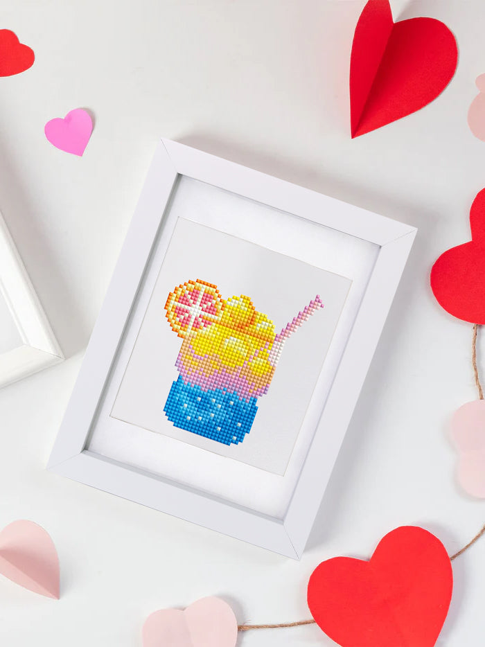 Cute blue tropical drink diamond art in white frame with hearts on white background – playful display.
