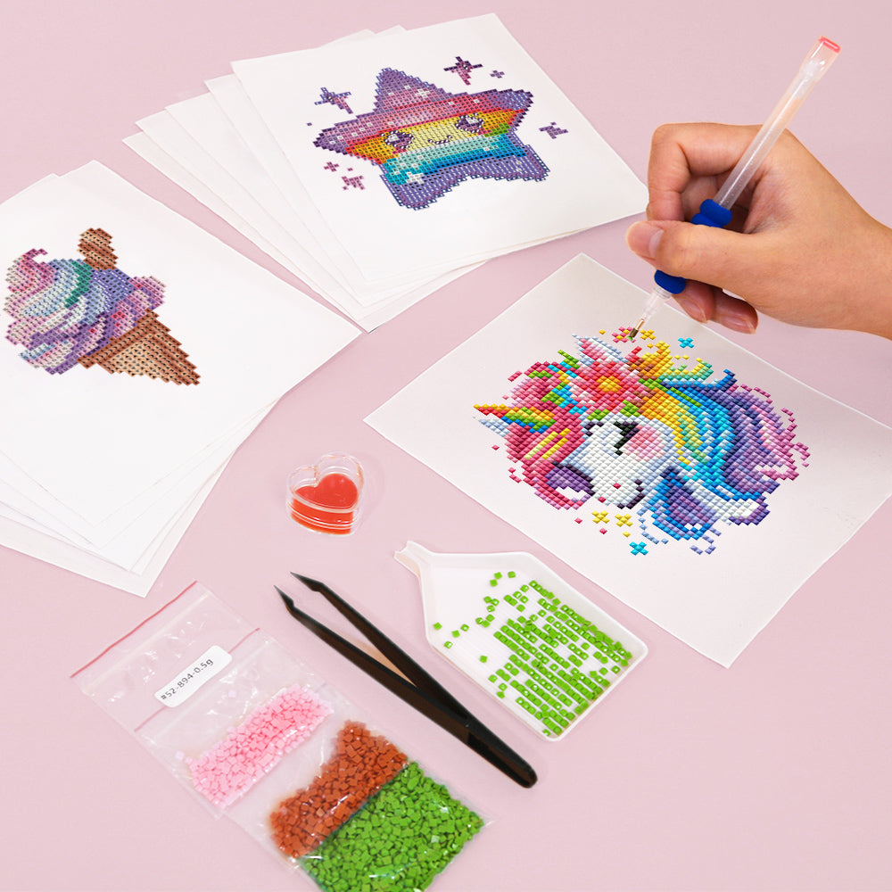 Hand placing drills on a unicorn diamond painting canvas from mini kit, showing beginner-friendly DIY steps with included tools and vibrant pastel colors.